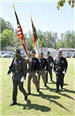Line of officers carrying flags