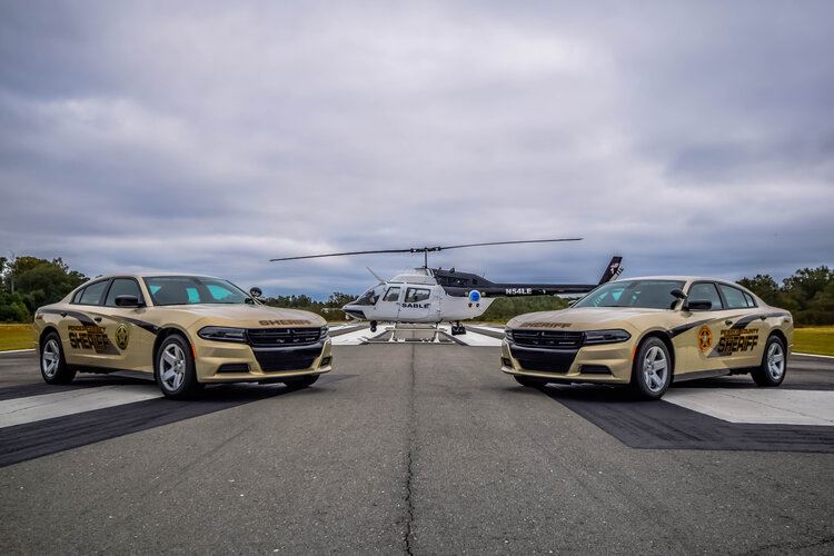 Sheriff cars and helicopter