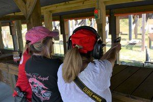 Women shooting pistols
