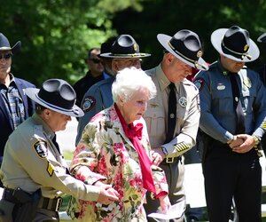 Police helping elderly lady