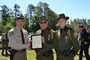 2 officers showing plaque